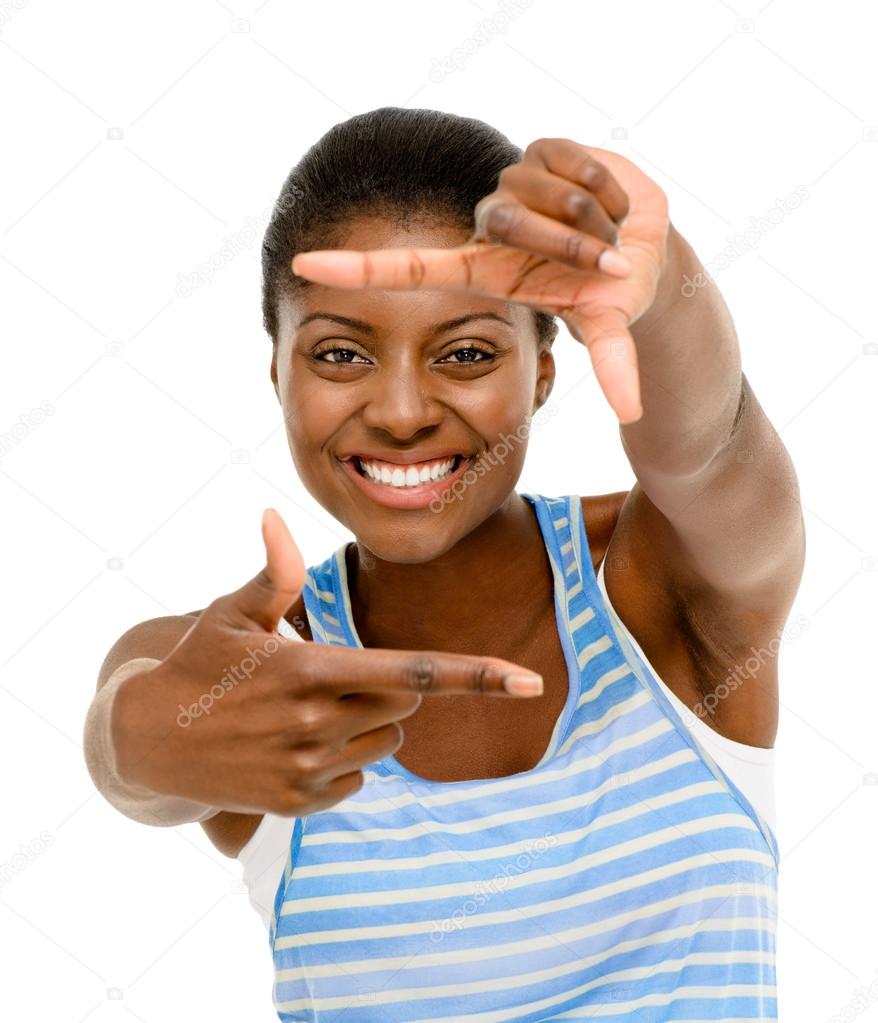 Pretty African American woman framing photograph using hand