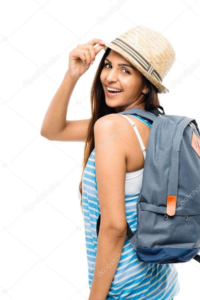 Pretty Indian woman tourist carrying backpack isolated on white