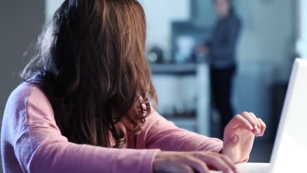 Young teenage girl browsing on the internet on laptop computer at home — Stock Video