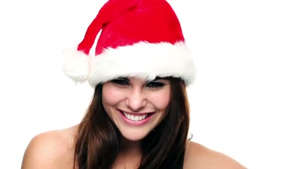 Attractive young woman wearing Christmas hat — Stock Video