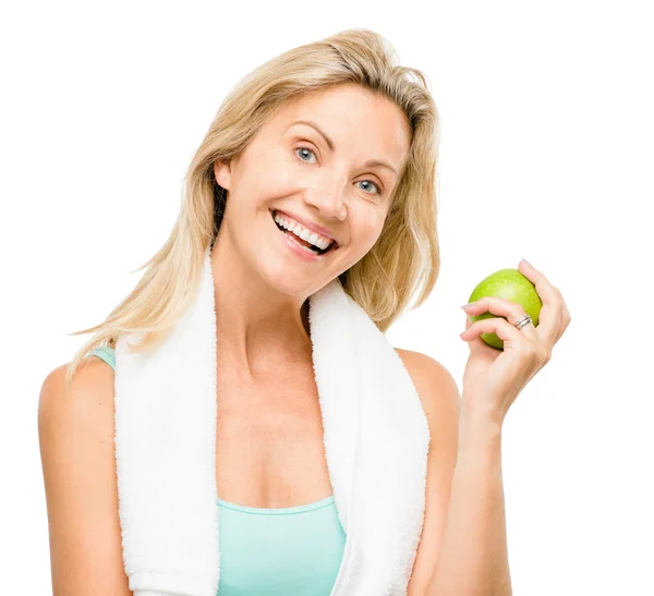 Healthy mature woman exercise green apple isolated on white background — Stock Photo, Image