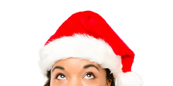 Close up of pretty African American girl wearing Christmas hat — Stock Photo, Image