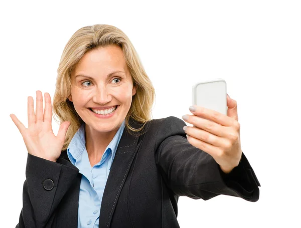 Video messaging mobile phone woman happy mature isolated on white background Stock Photo