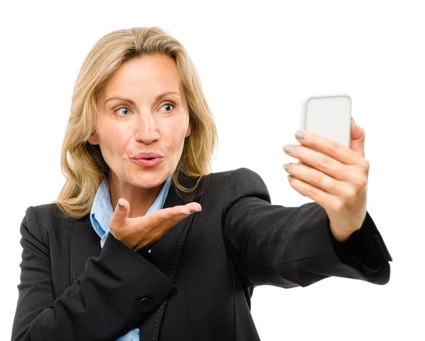 Video messaging mobile phone woman happy mature isolated on white background Stock Photo