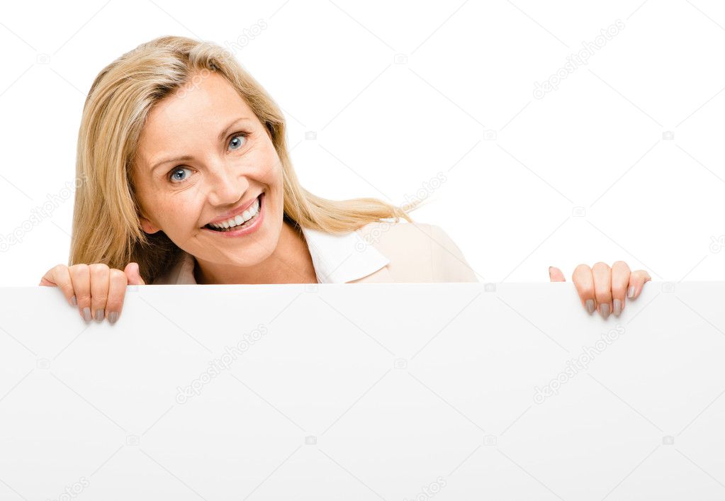 Mature business woman leaning on white banner smiling isolated o