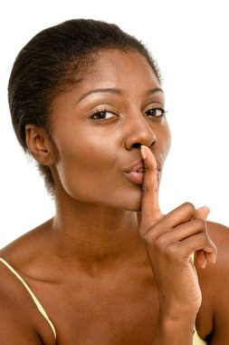 Cute African American woman finger on lips isolated on white bac clipart