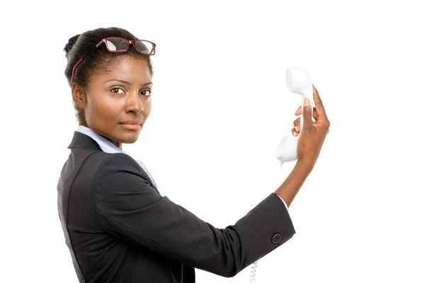 African American woman confused holding analogue phone isolated — Stock Photo, Image