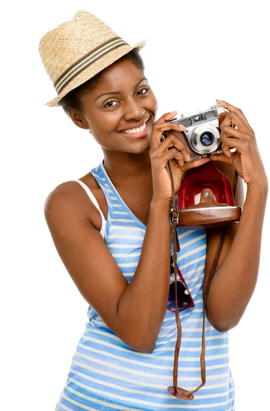 Happy African American woman tourist holding vintage camera isolated on white background — Stock Photo, Image