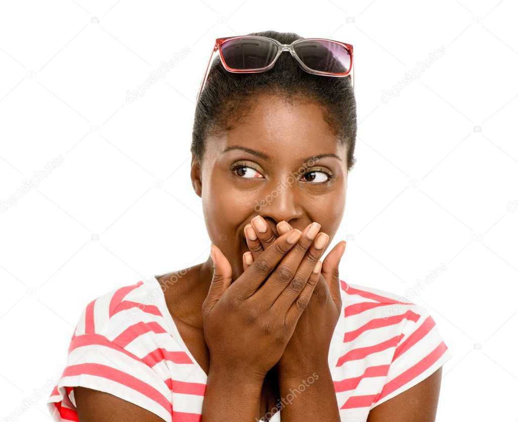 Cute African American woman hand covering mouth isolated on whit
