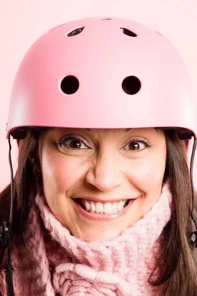 Funny woman wearing Cycling Helmet portrait pink background real — Stock Photo, Image