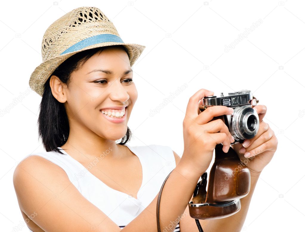 Beautiful mixed race woman taking photograph vintage camera isol