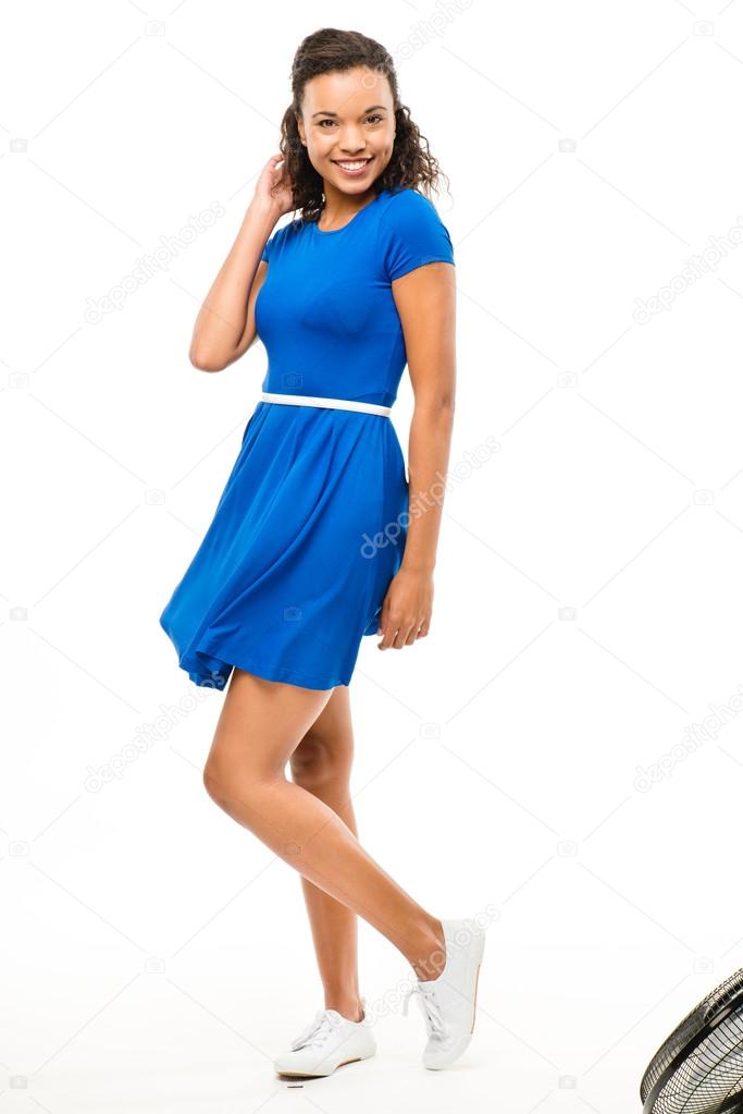 Beautiful mixed race woman dancing sexy blue dress isolated on w