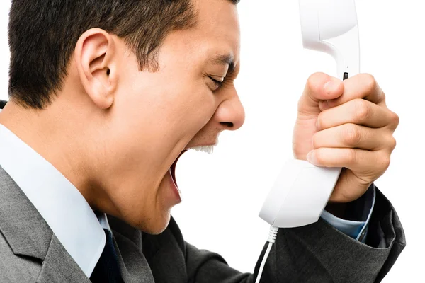 Азиатский бизнесмен кричит по телефону — стоковое фото