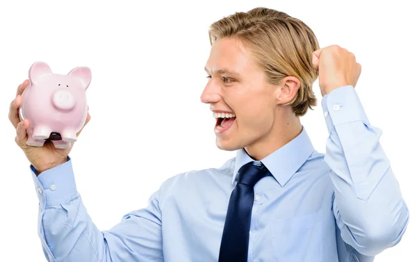 Confident young businessman holding piggybank is successful — Stock Photo, Image