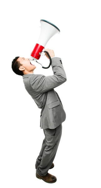 Crazy Asian businessman screaming in megaphone on white backgrou — Stock Photo, Image