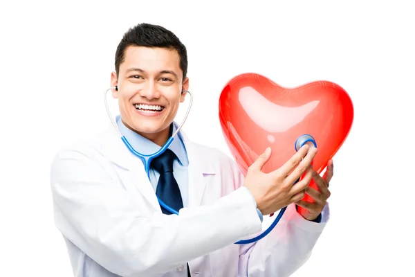 Portrait of happy asian doctor listening to heartbeat isolated o — Stock Photo, Image