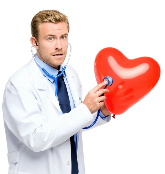 Doctor holding heart on white background — Stock Photo, Image