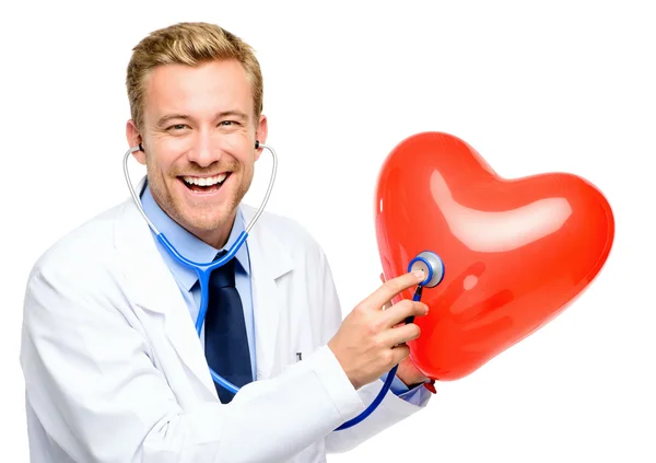 Doctor holding heart on white background — Stock Photo, Image