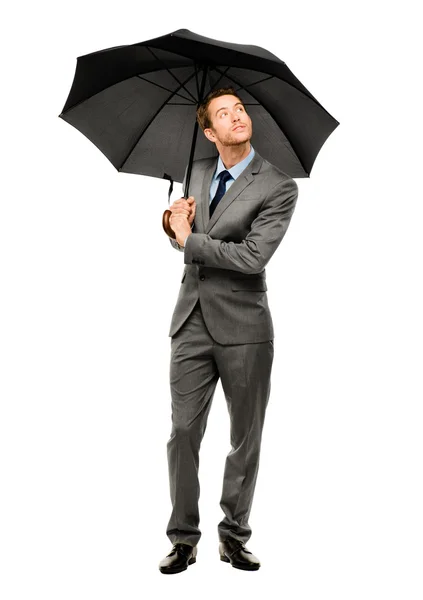 Businessman holding umbrella smiling isolated white background Stock Picture