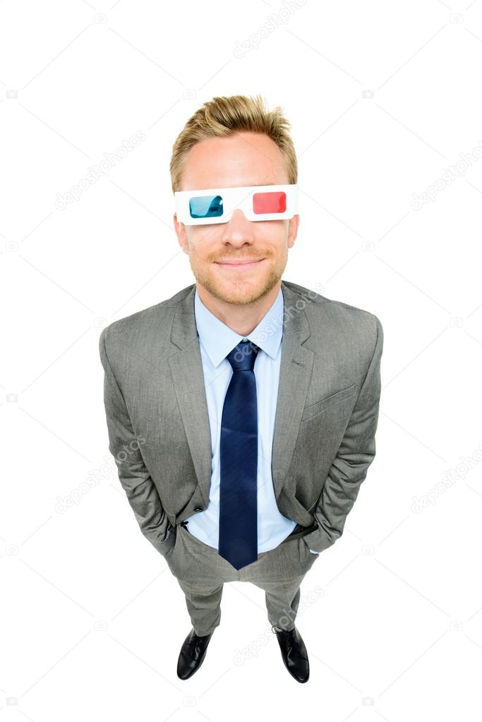 Full length businessman wearing 3d glasses on white