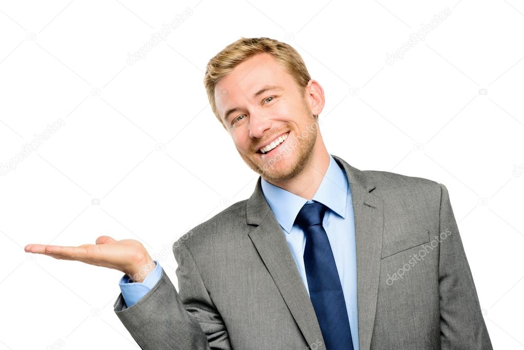 Happy young businessman showing empty copyspace on white backgro