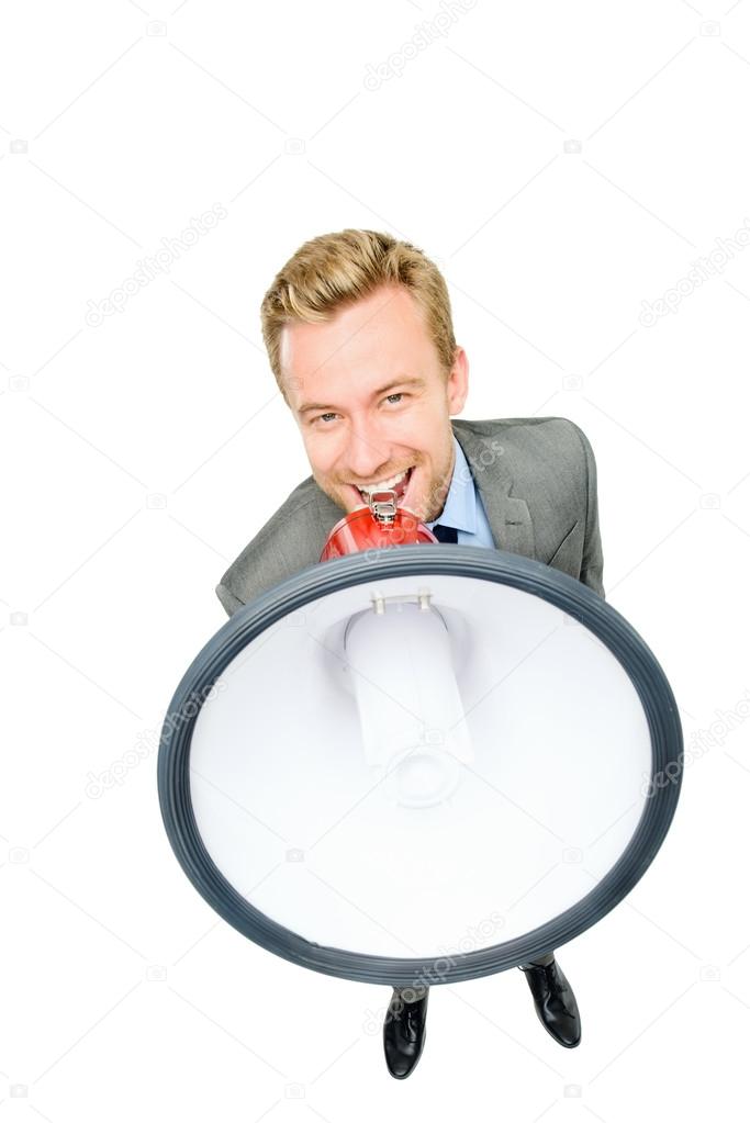Happy young bussinessman shouting with megaphone on white backgr