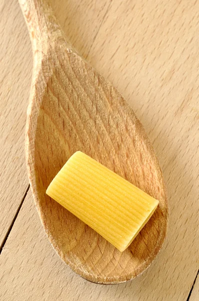Rigatone on a wooden spoon — Stock Photo, Image