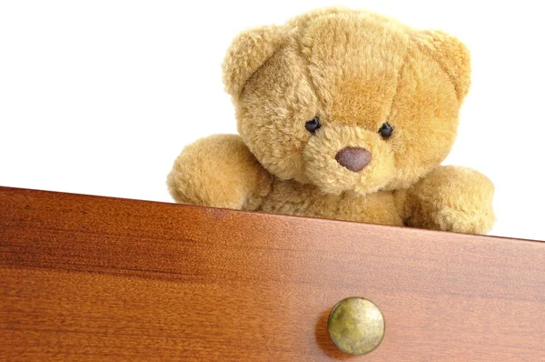 Teddy bear in a wooden drawer — Stock Photo, Image
