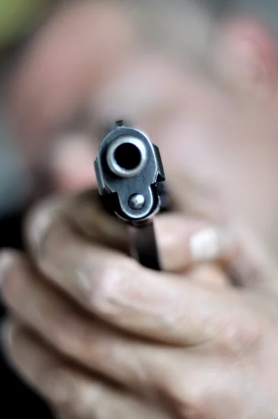 Man with a gun — Stock Photo, Image