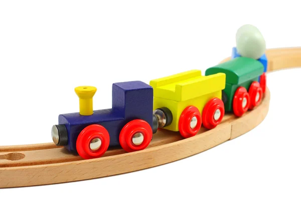 Juguete de tren de madera sobre raíles aislados en blanco — Foto de Stock