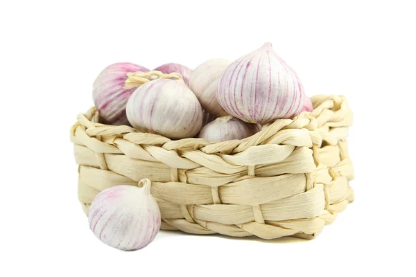 Chinese garlic in a wicker basket isolated over white — Stock Photo, Image