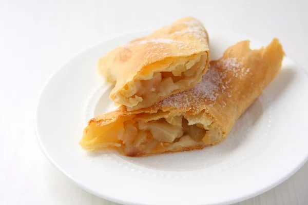 Fresh Apfelstrudel on a plate — Stockfoto