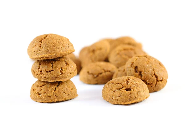 Pile of ginger nuts (pepernoten) isolated on white background — Stock Photo, Image
