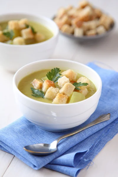 Creamy sweet potato soup with croutons and parsley in white bowl — Stock Photo, Image