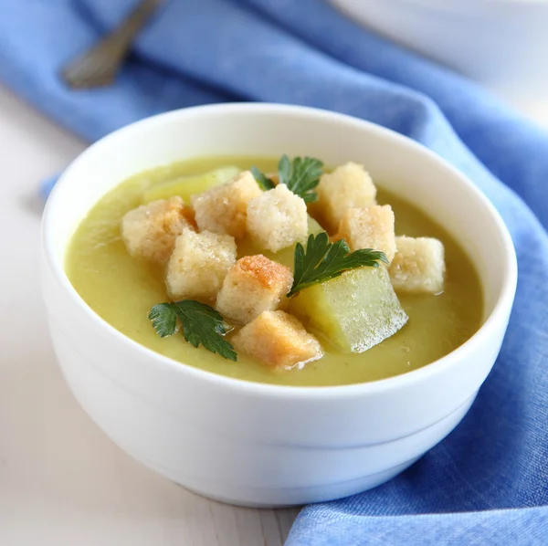 Creamy sweet potato soup with croutons and parsley in white bowl — Stock Photo, Image