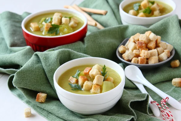 Creamy sweet potato soup with croutons and parsley in white bowl — Stock Photo, Image