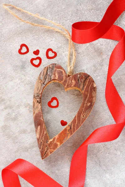 Heart made from tree bark on wooden background — Stock Photo, Image