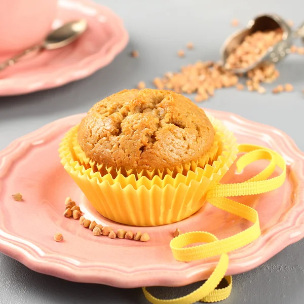 stock image Freshly baked buckwheat muffins on the rose plate