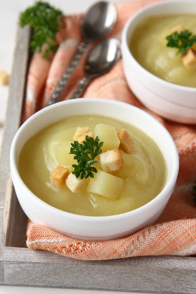 Creamy sweet potato soup with croutons and parsley in white bowl — Stock Photo, Image