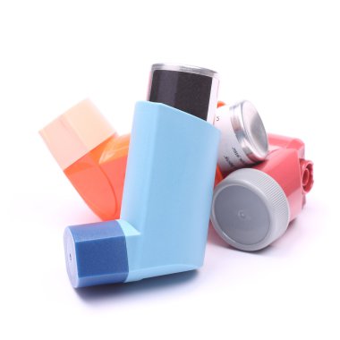 Asthma inhalers isolated over white clipart