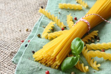 Uncooked gluten free pasta from blend of corn and rice flour clipart