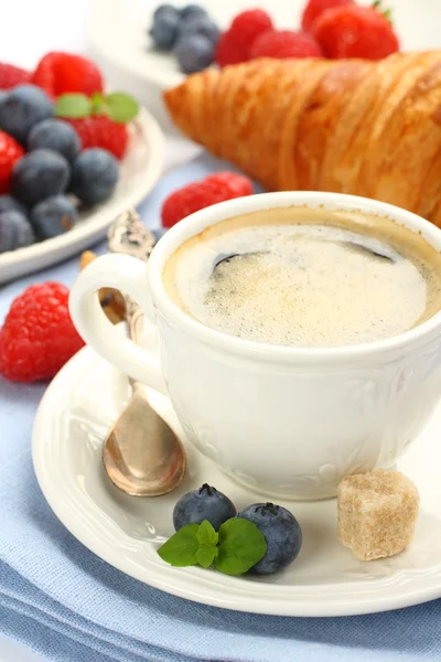 Breakfast with cup of coffee, croissants and berries — Stock Photo, Image