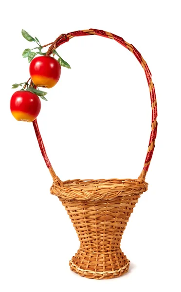 stock image Wicker basket decorated with two artificial apples