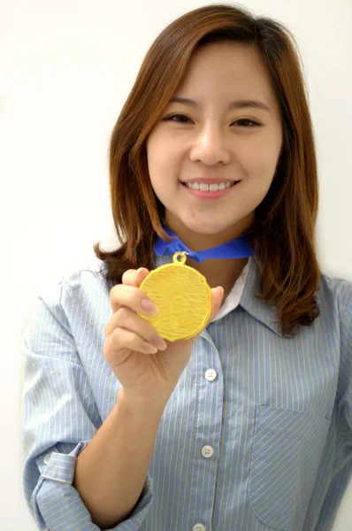 Young Businesswoman holds up her gold medal — Stock Photo, Image