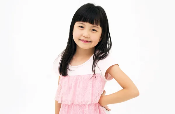 Lykkelig liten jente med hvit bakgrunn – stockfoto