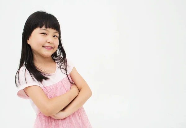 Beautiful asian child with her arms crossed — Stock Photo, Image