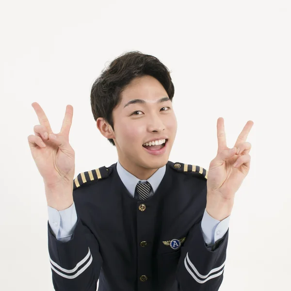 Sonriente asiática aerolínea piloto — Foto de Stock