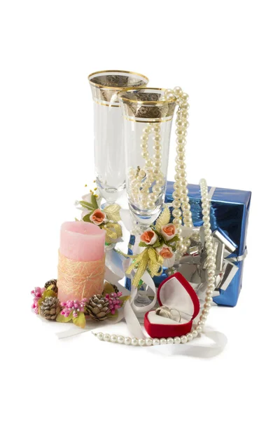 Costume jewelry, candles, wine glasses — Stock Photo, Image