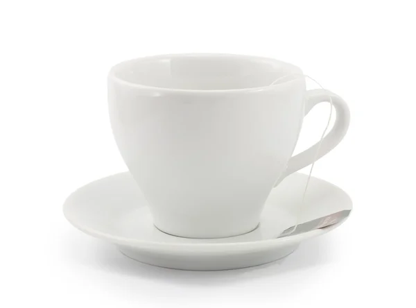 Sacs de thé noir dans une tasse blanche — Photo