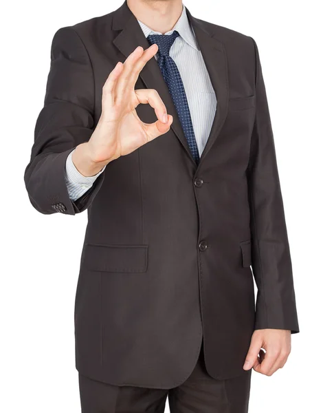 Man in suit shows hand ok — Stock Photo, Image